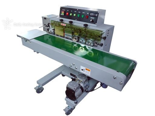 Horizontal nozzle vacuum band sealer